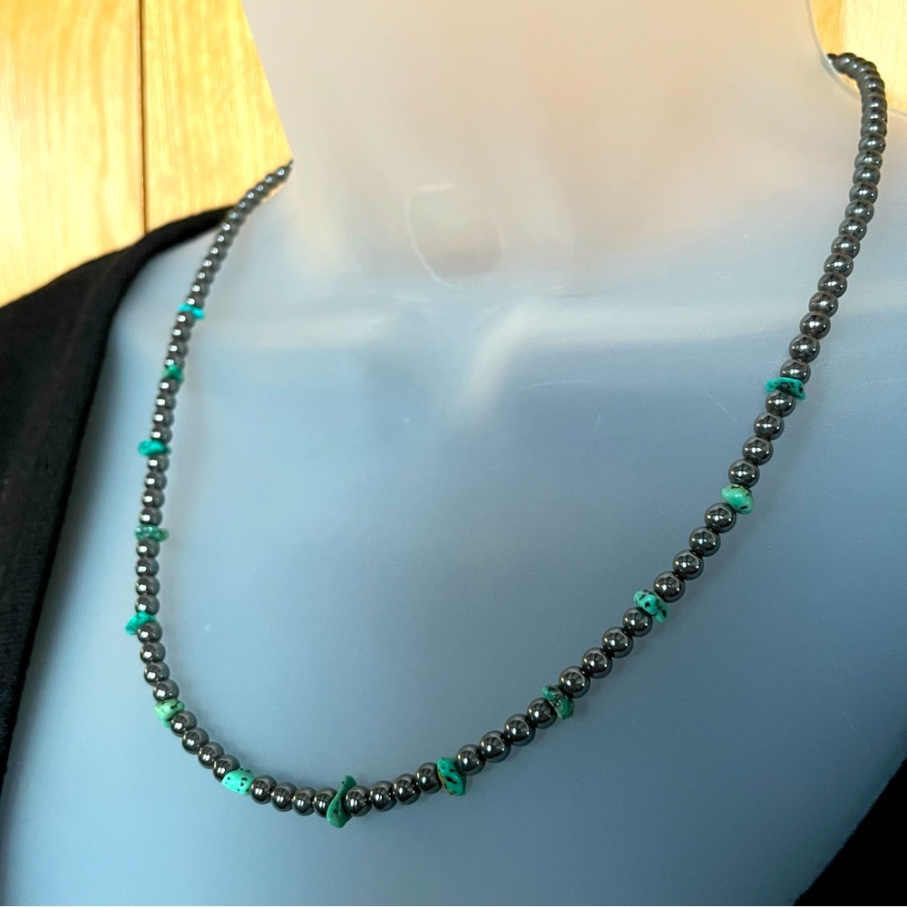 Hematite beads interspersed with turquoise chunks in a dainty 20" necklace.